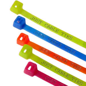 Close-up of brightly colored fluorescent cable ties in black and natural, showcasing custom printed text on their surface, with one tie securing a bundle of cables in a dimly lit setting.